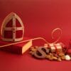Boek van sinterklaas, mijter en staf en sint chocolade