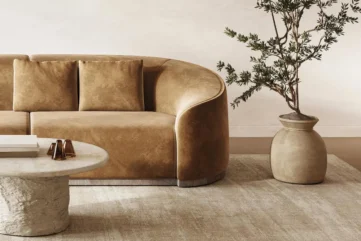 Moderne bruine bank met ronde salontafel en plant