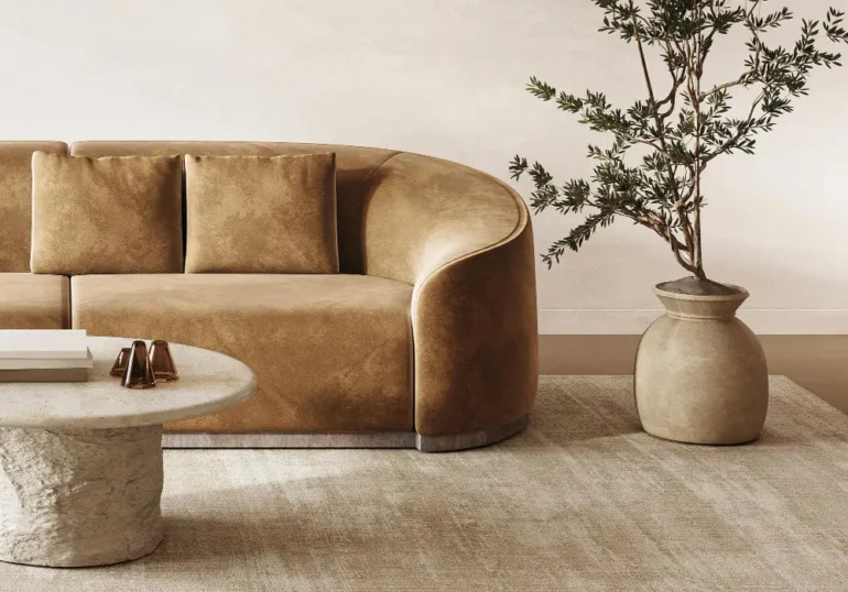 Moderne bruine bank met ronde salontafel en plant